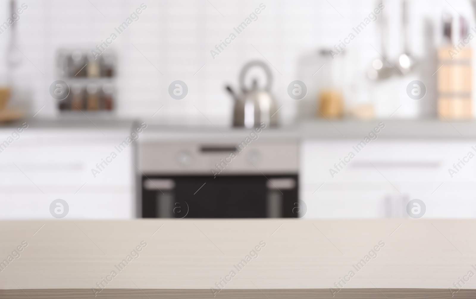 Photo of Countertop and blurred view of kitchen interior. Idea for home design