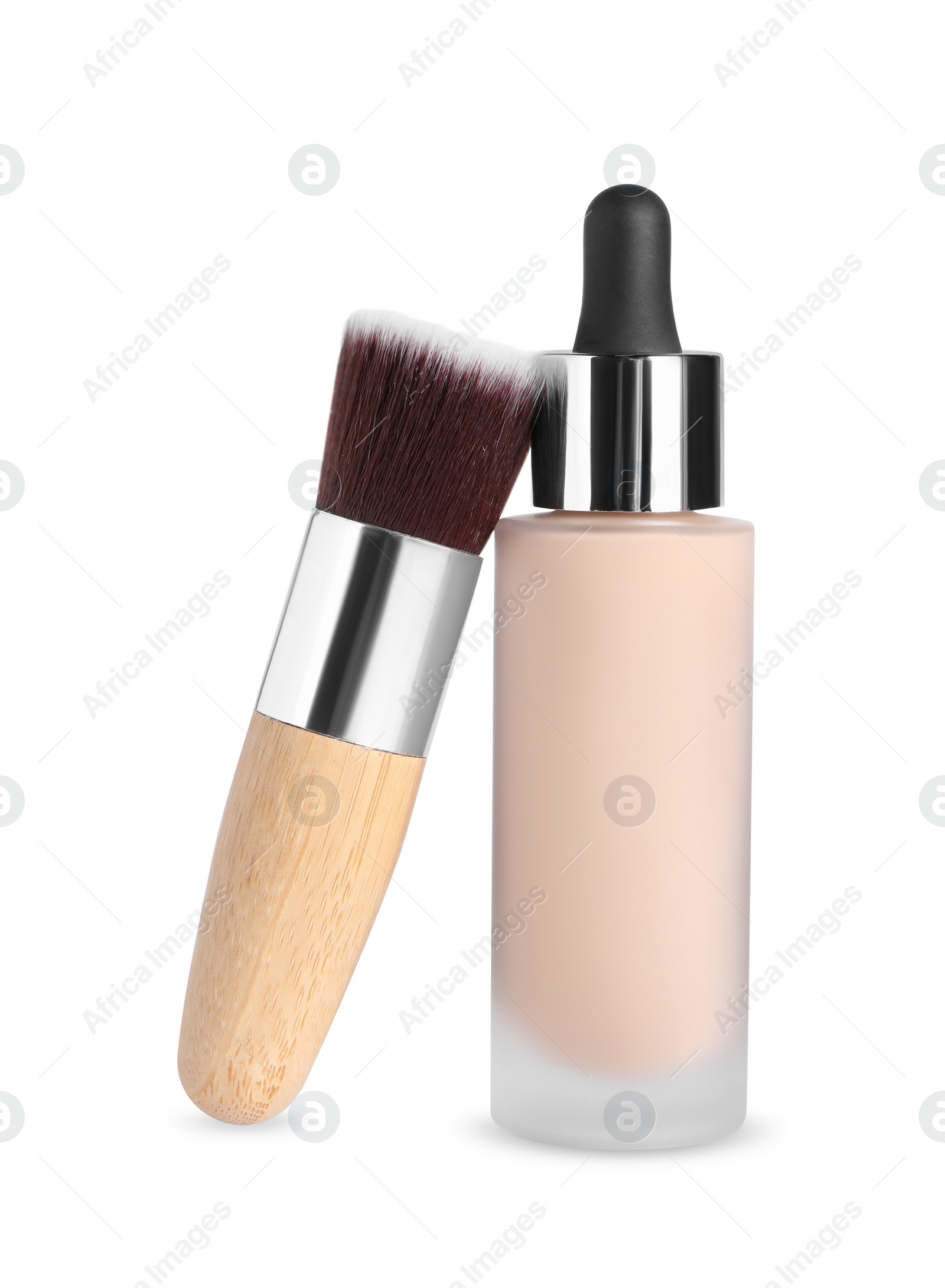 Photo of Bottle of skin foundation and brush on white background. Makeup product