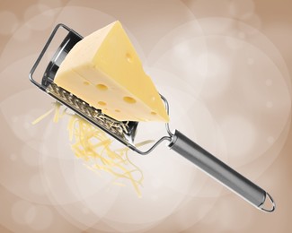 Image of Grating cheese with hand grater on dark beige background