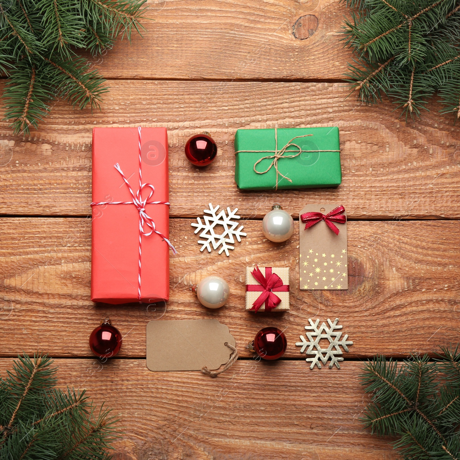 Photo of Flat lay composition with Christmas decorations on wooden background. Winter season