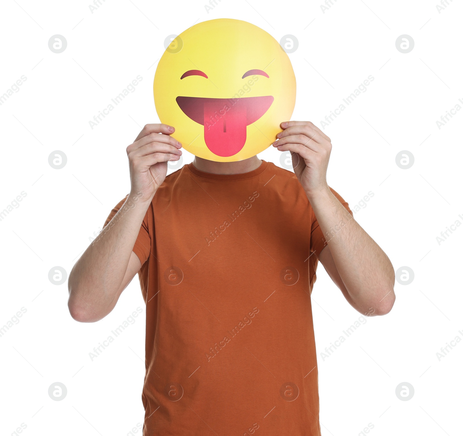 Photo of Man covering face with emoticon sticking out tongue on white background