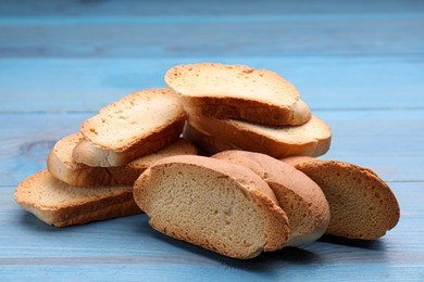 Photo of Hard chuck crackers on light blue wooden table