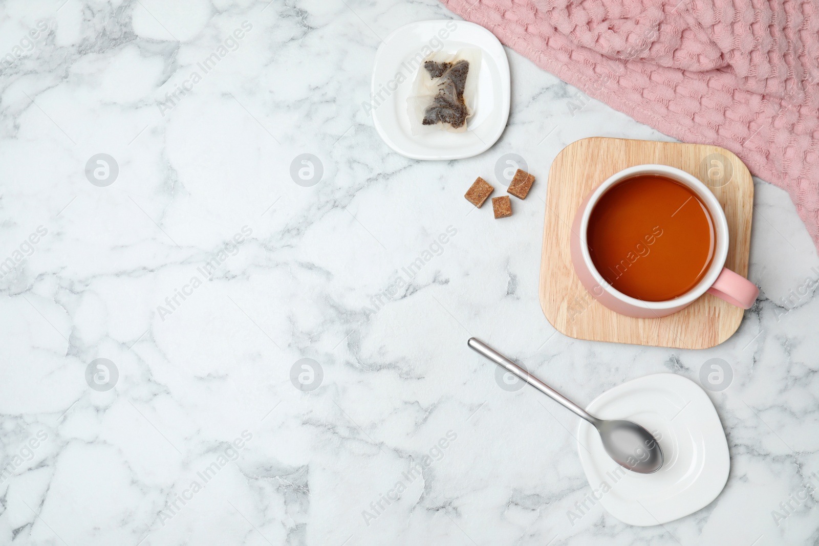 Photo of Flat lay composition with delicious hot tea and space for text on marble background