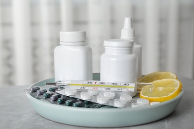 Photo of Different cold remedies on light grey marble table