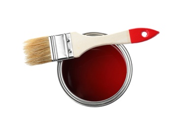 Paint can and brush on white background, top view