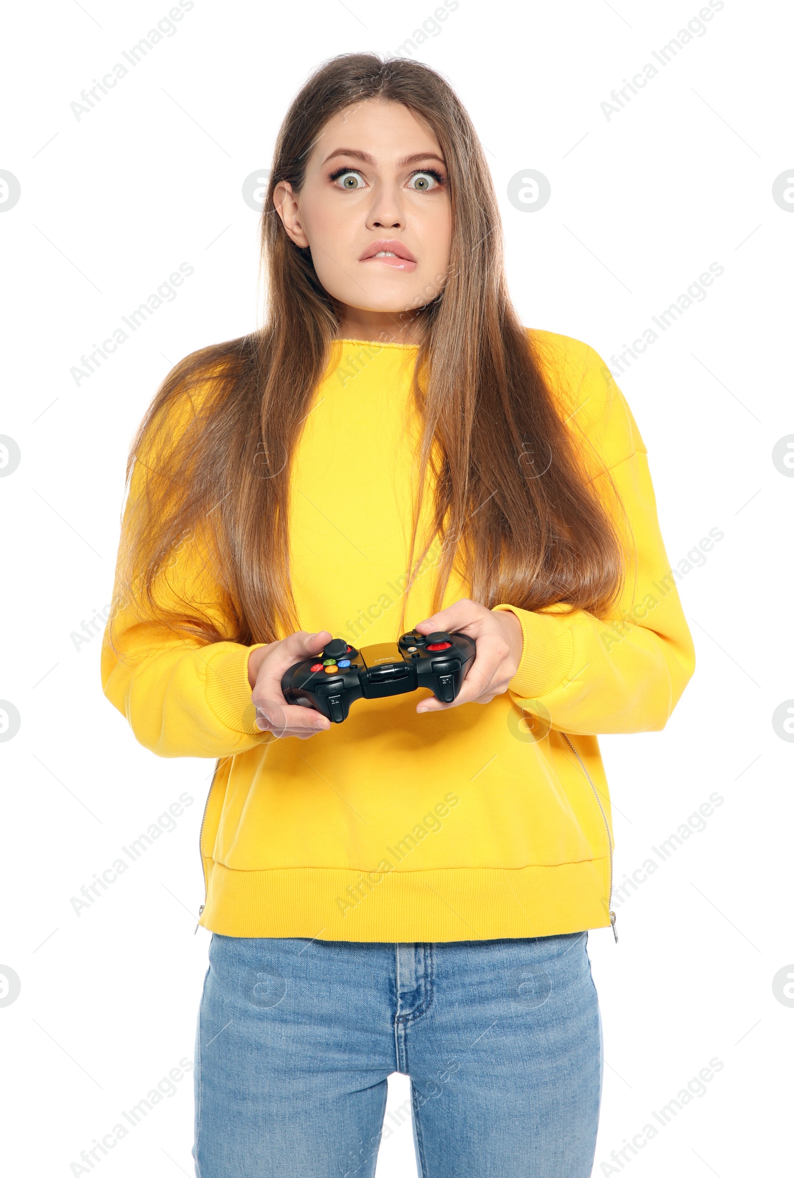 Photo of Emotional young woman playing video games with controller isolated on white