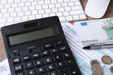 Photo of Tax accounting. Calculator, document, money, keyboard and pen on table, closeup