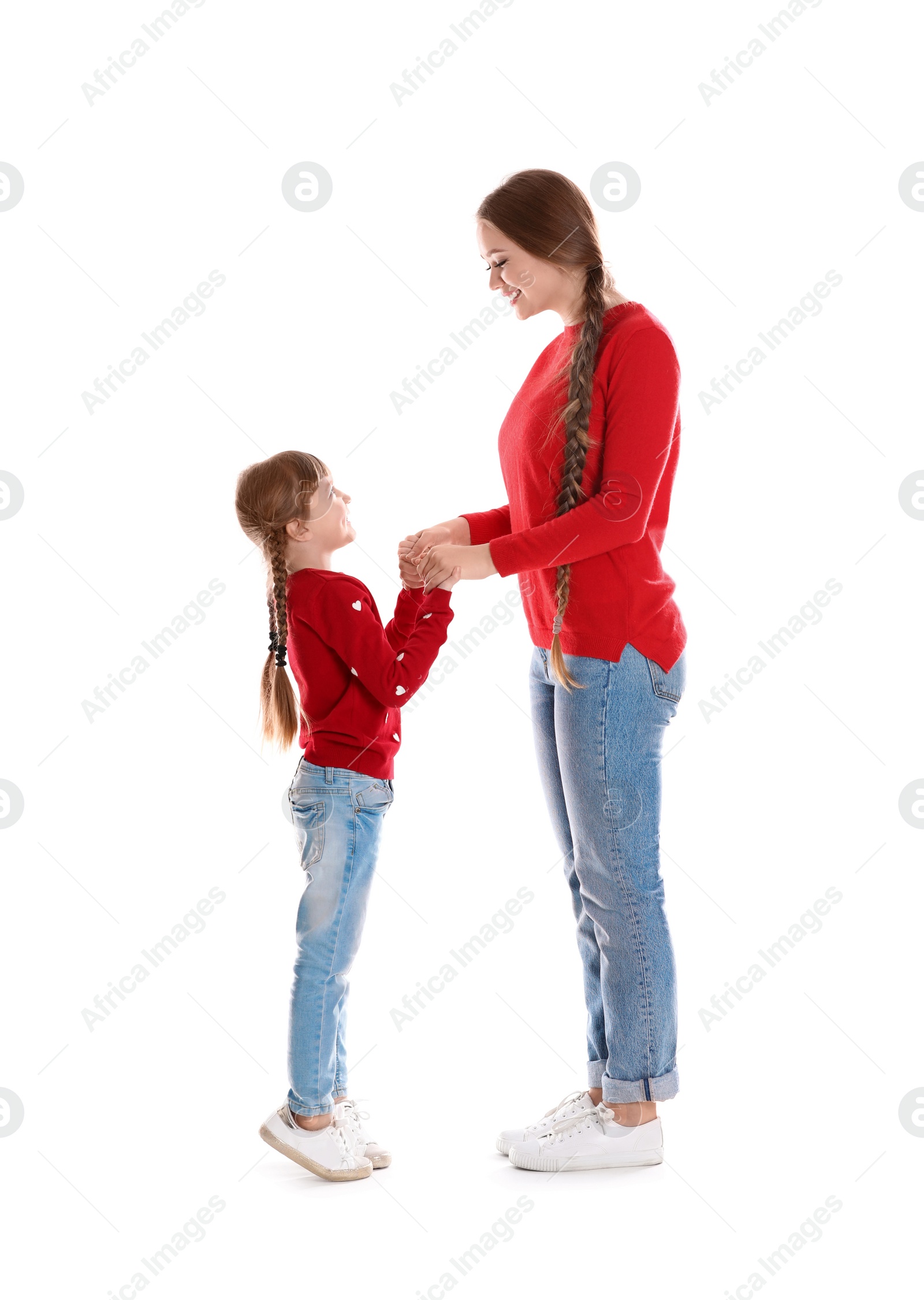 Photo of Happy woman and daughter in stylish clothes on white background