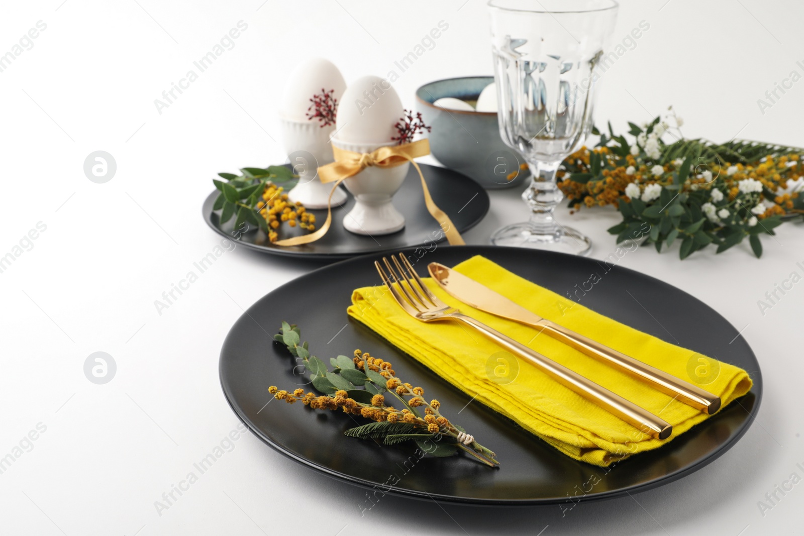 Photo of Festive Easter table setting with beautiful floral decor