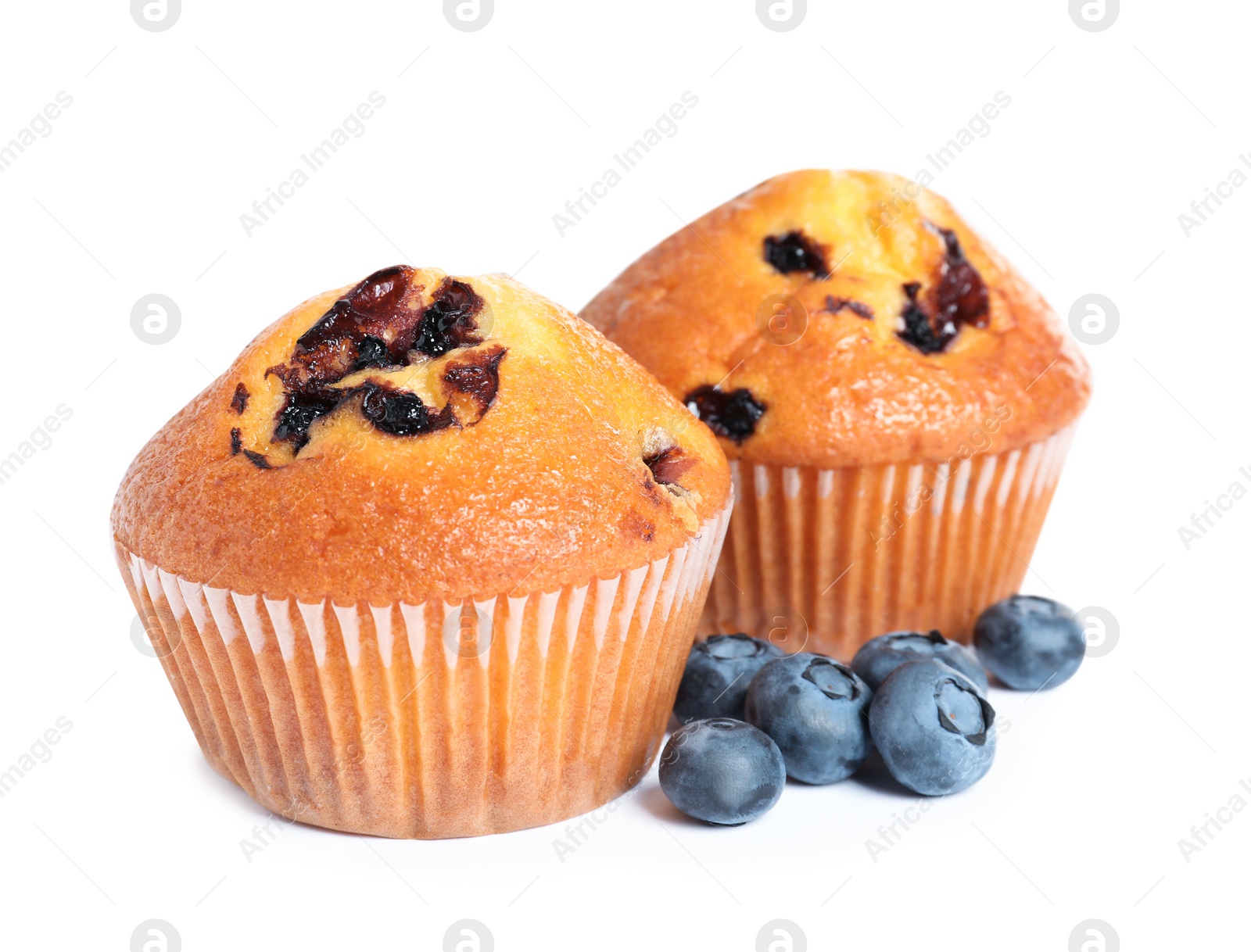 Photo of Tasty muffins with blueberries on white background