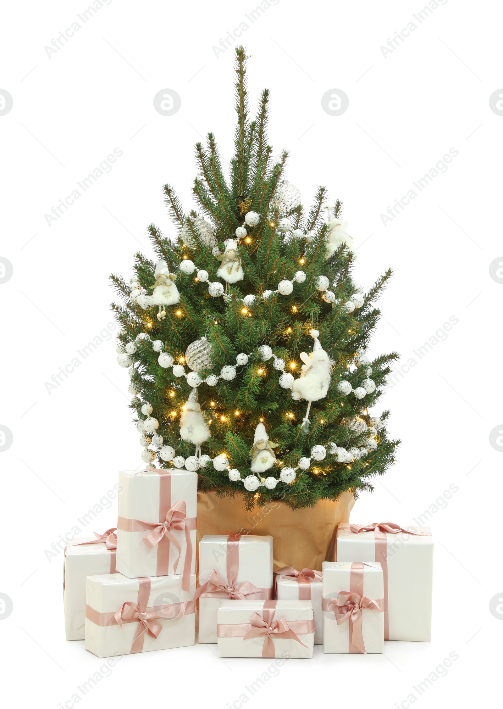 Photo of Beautiful decorated Christmas tree and gift boxes on white background