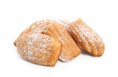 Delicious madeleine cakes with powdered sugar on white background