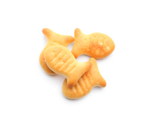 Photo of Delicious crispy goldfish crackers on white background, top view