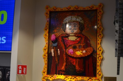 Photo of AMSTERDAM, NETHERLANDS - AUGUST 06, 2022: Picture made with colorful Lego constructor on white wall indoors