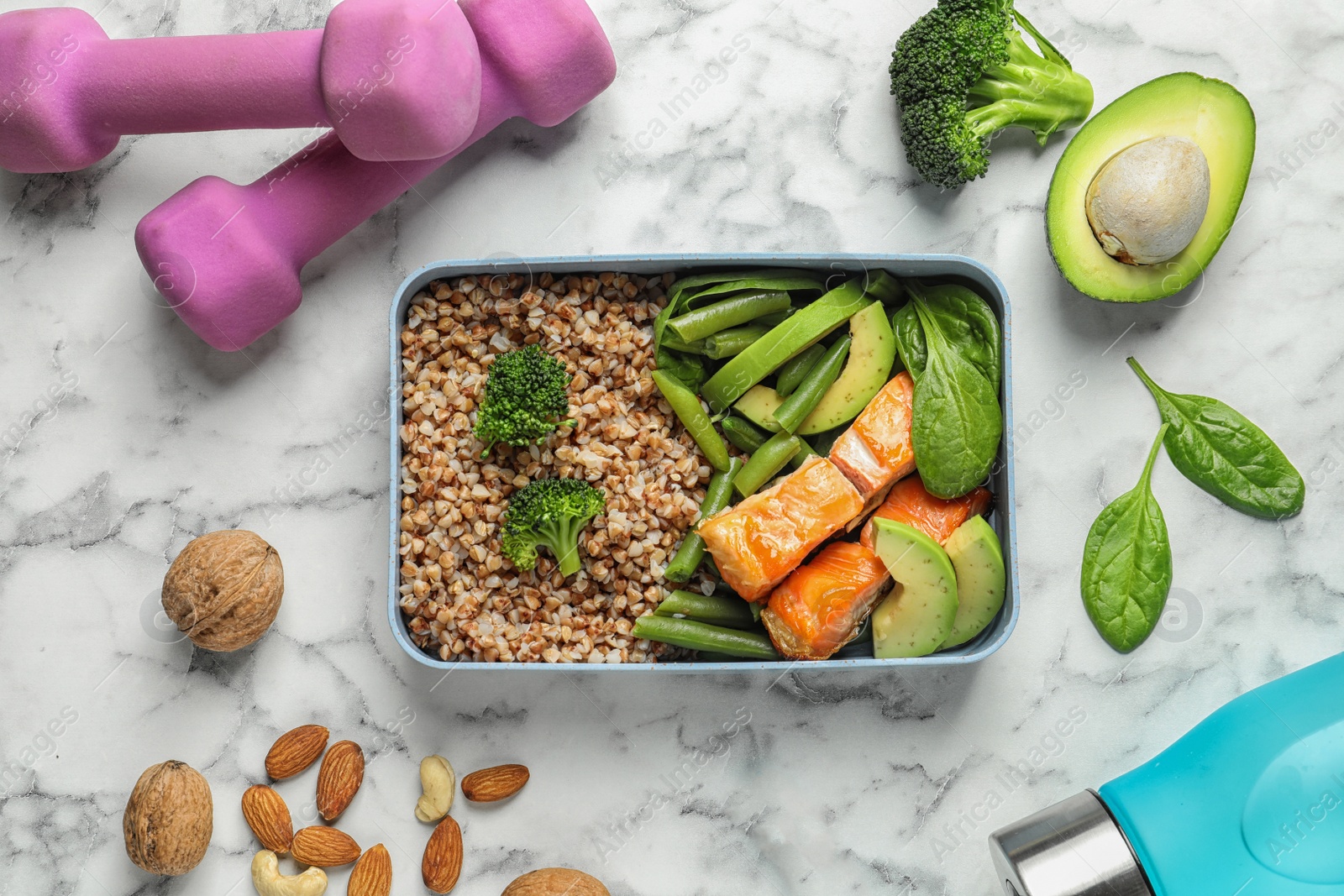 Photo of Flat lay composition with container of natural protein food on marble background