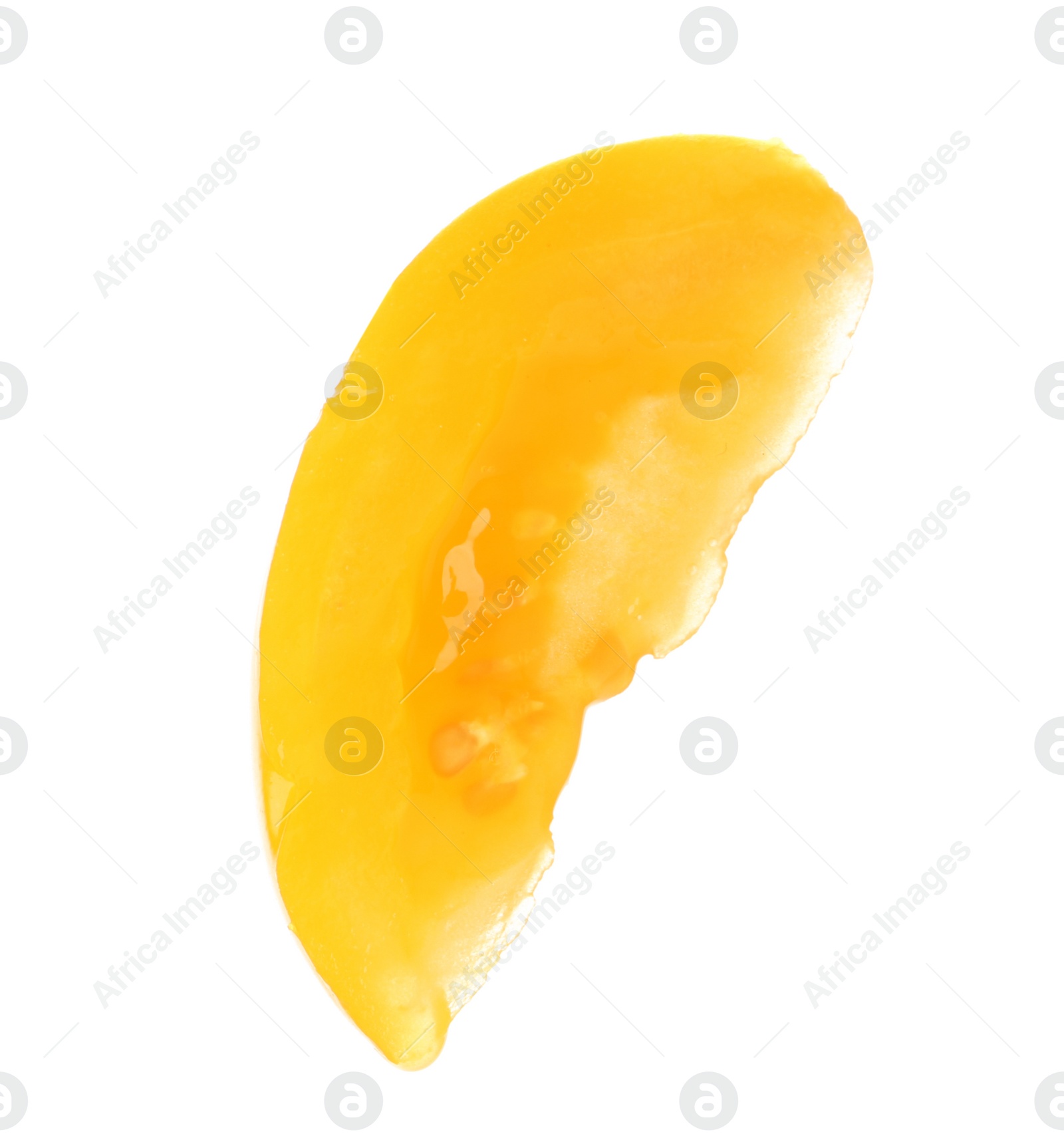 Photo of Slice of yellow tomato on white background