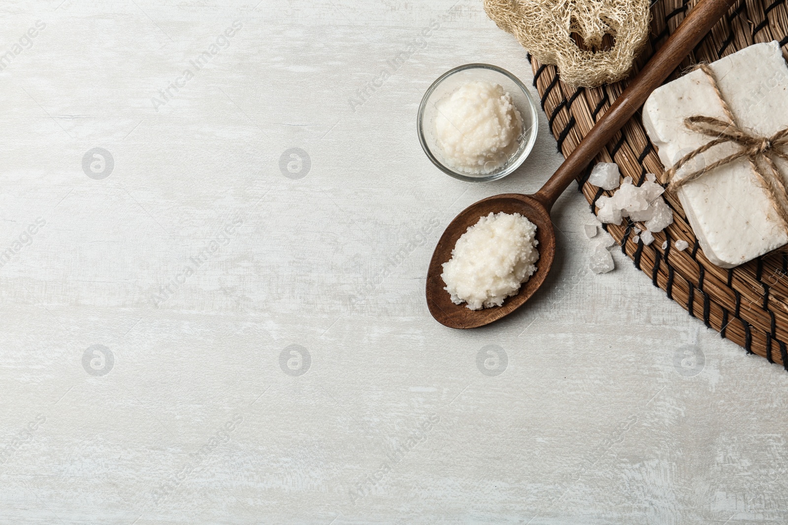 Photo of Flat lay composition with Shea butter and handmade soap on light background. Space for text