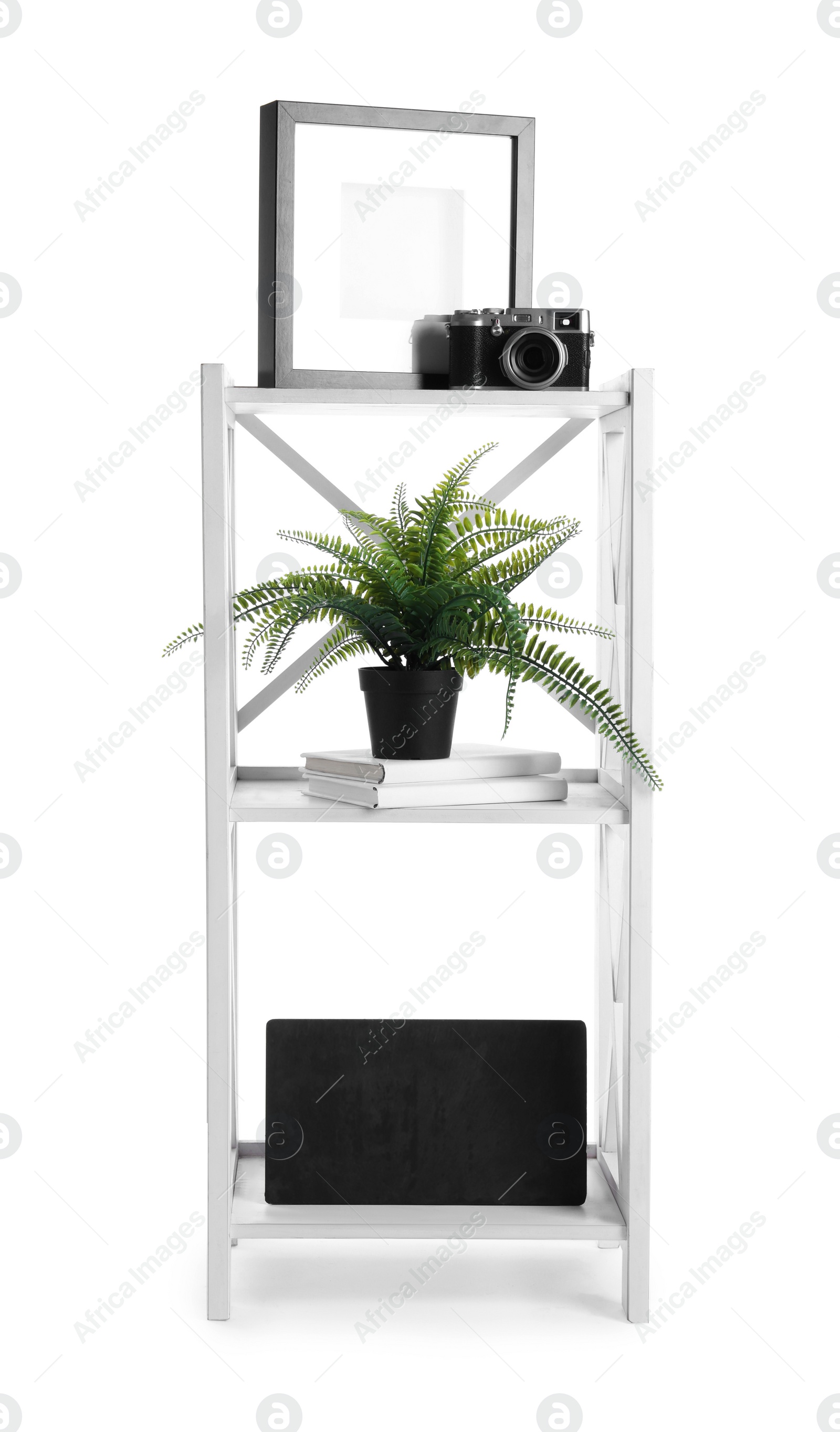 Photo of Wooden shelving unit with different items isolated on white