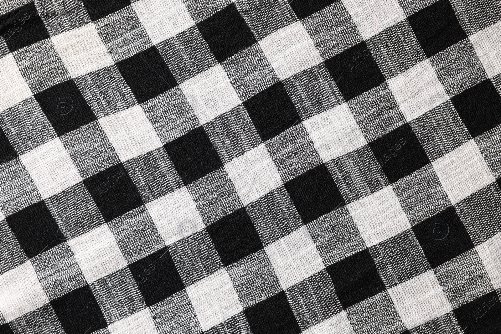 Photo of Black checkered tablecloth as background, top view