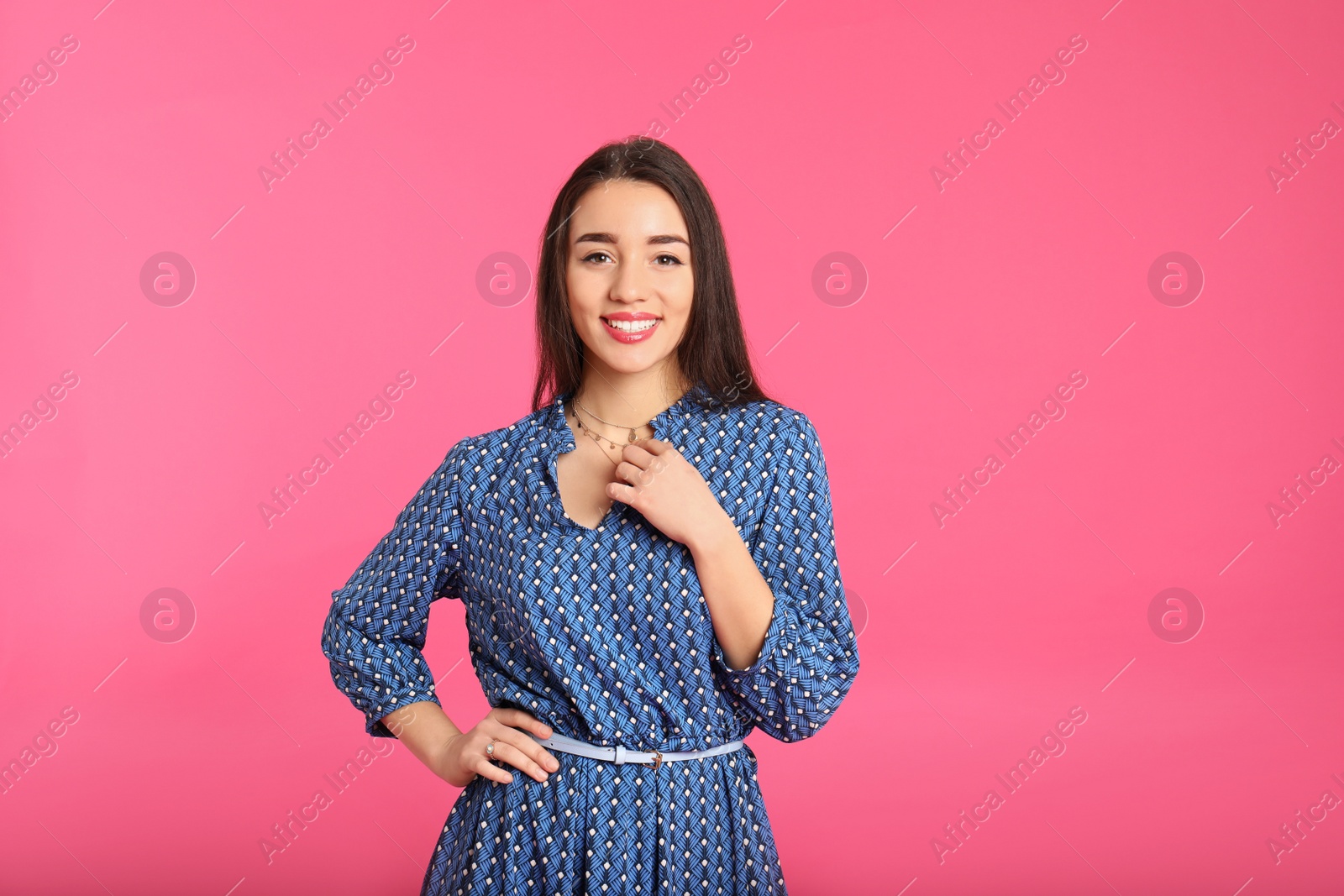 Photo of Portrait of beautiful young woman in stylish dress on color background