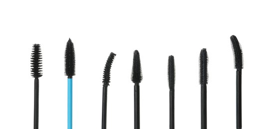 Many mascara wands for eyelashes on white background. Makeup product