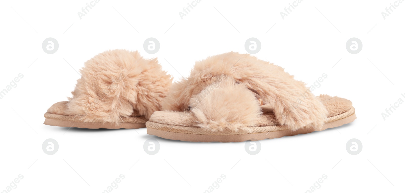 Photo of Pair of soft fluffy slippers on white background