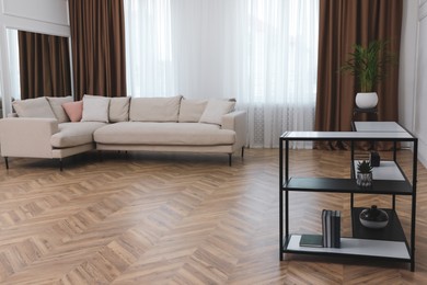 Modern living room with parquet flooring and stylish furniture