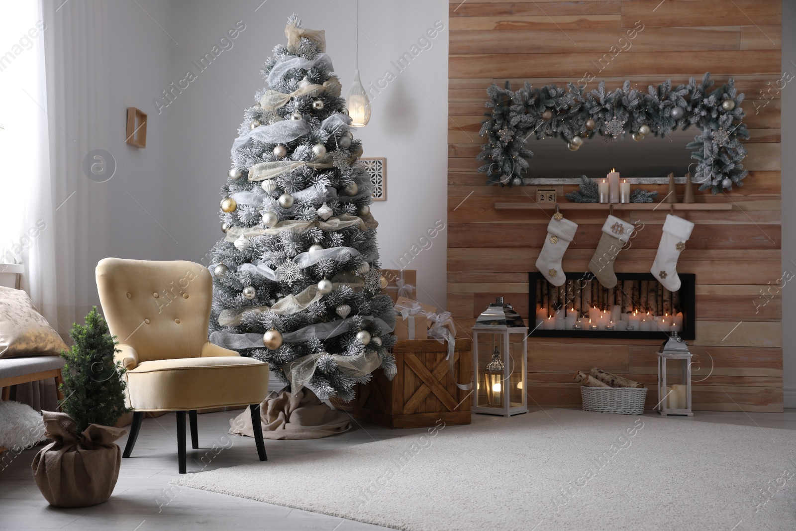 Photo of Festive interior with beautiful Christmas tree and gifts