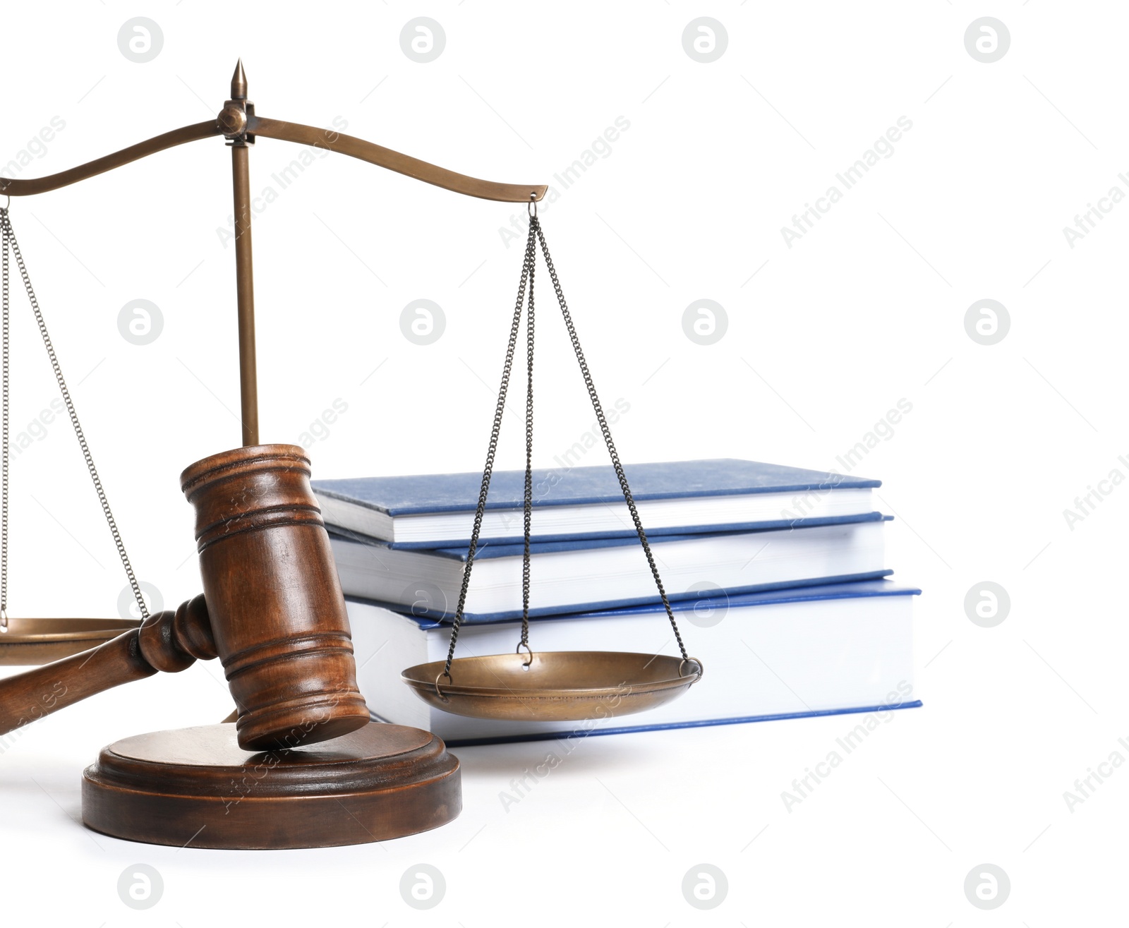 Photo of Wooden gavel, scales of justice and books on white background. Law concept