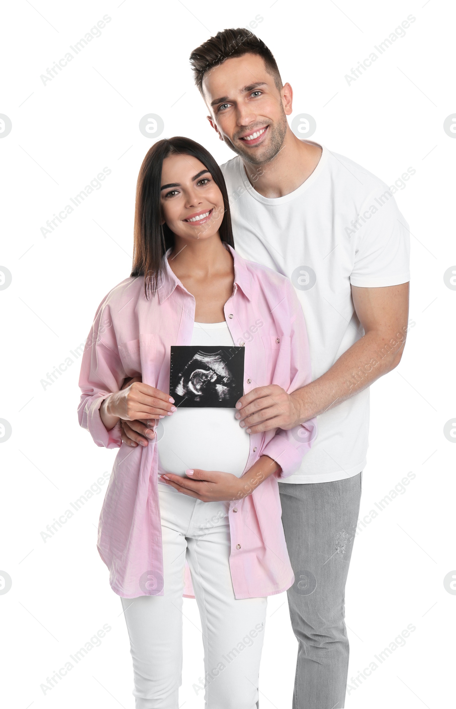 Photo of Happy young family with ultrasound picture on white background