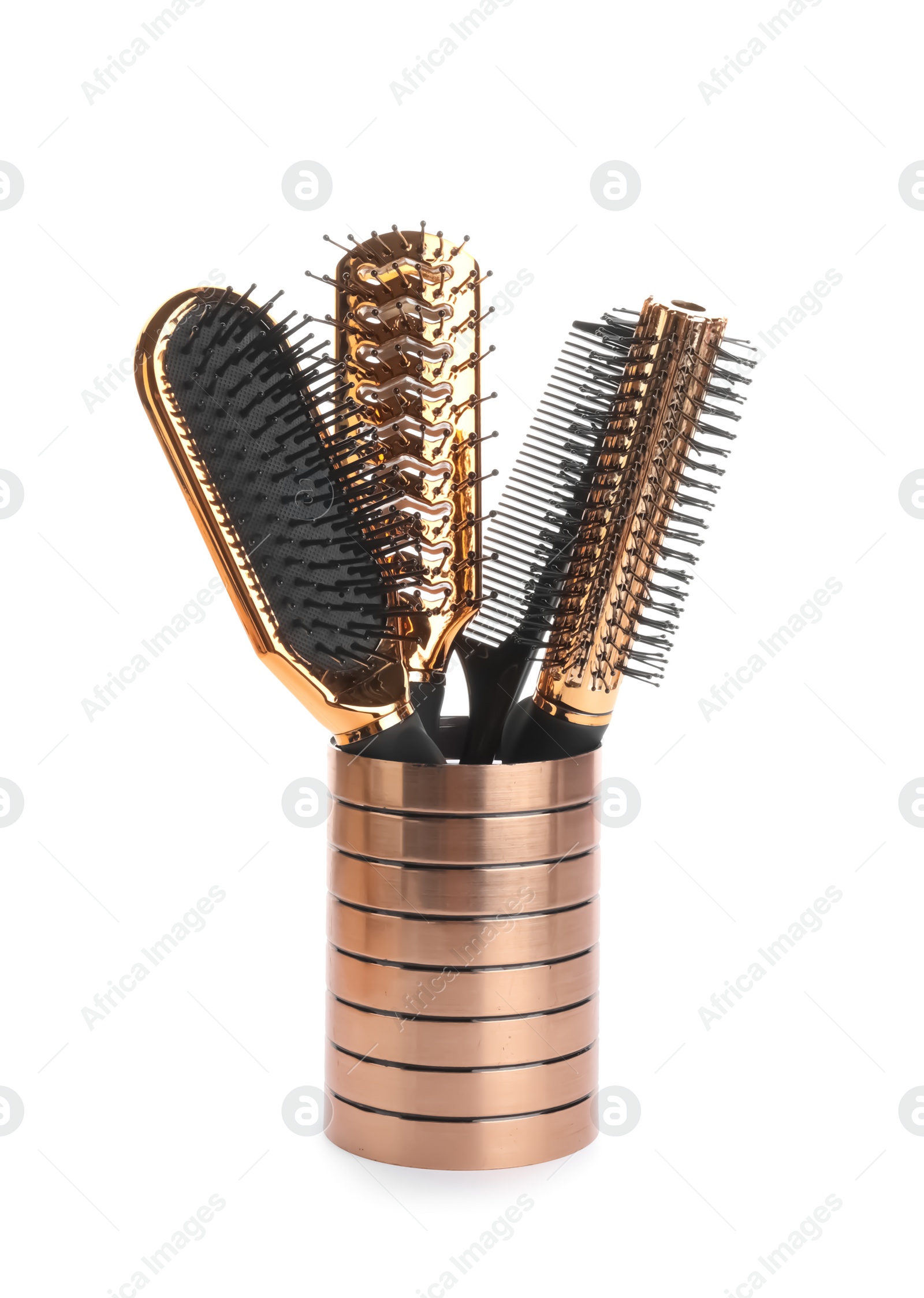 Photo of Different hair brushes and comb in holder isolated on white