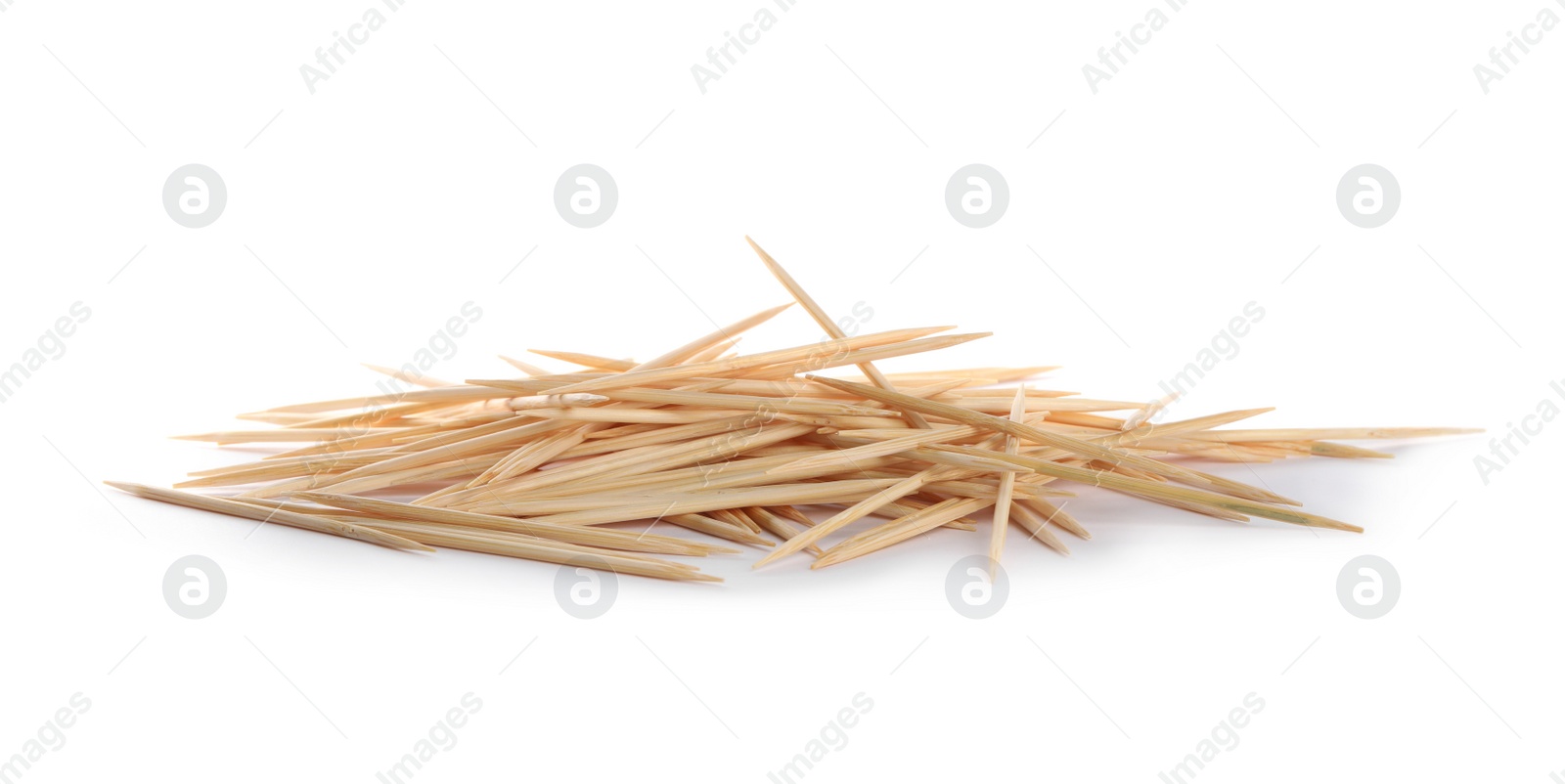 Photo of Heap of wooden toothpicks on white background