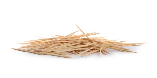 Heap of wooden toothpicks on white background