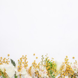 Photo of Beautiful floral composition with mimosa flowers on white background, flat lay. Space for text