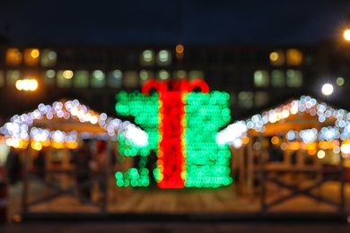 Photo of Beautiful bright Christmas decor outdoors. Bokeh effect