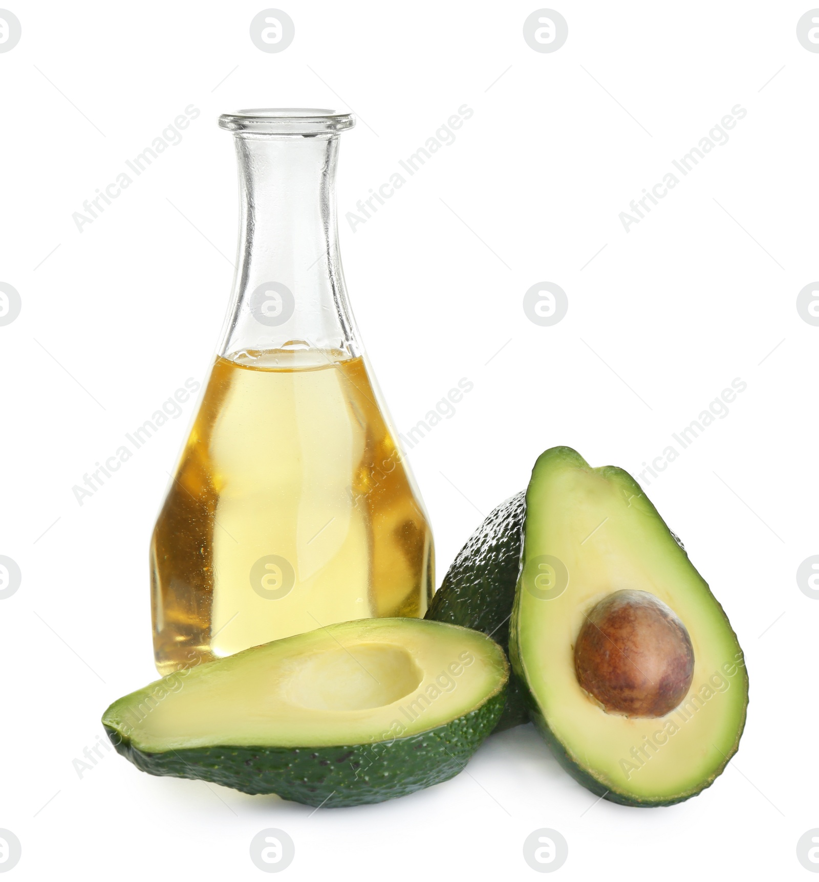 Photo of Bottle of natural oil and avocados isolated on white