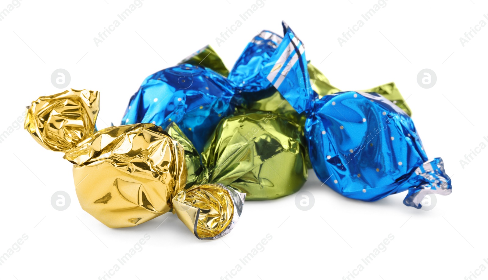 Photo of Candies in colorful wrappers isolated on white