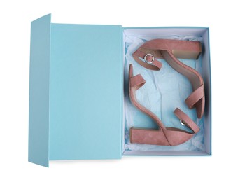 Photo of Pair of stylish leather shoes in turquoise box on white background, top view