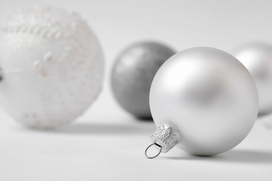 Photo of Many beautiful Christmas balls on white background