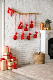 Beautiful interior with New Year advent calendar on white brick wall