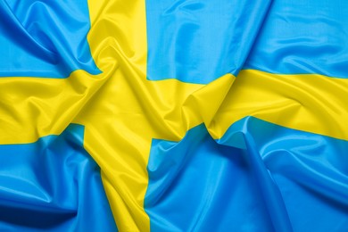 Photo of Flag of Sweden as background, top view. National symbol