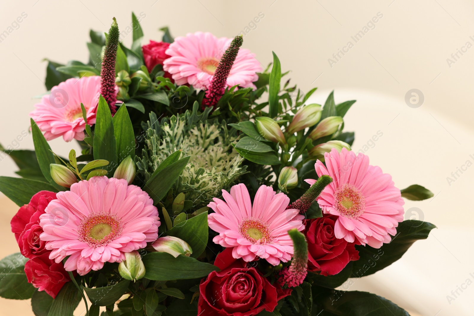 Photo of Bouquet of beautiful flowers on light background, closeup