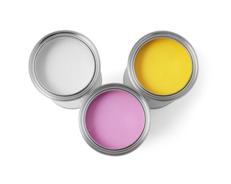 Cans with different paints on white background, top view