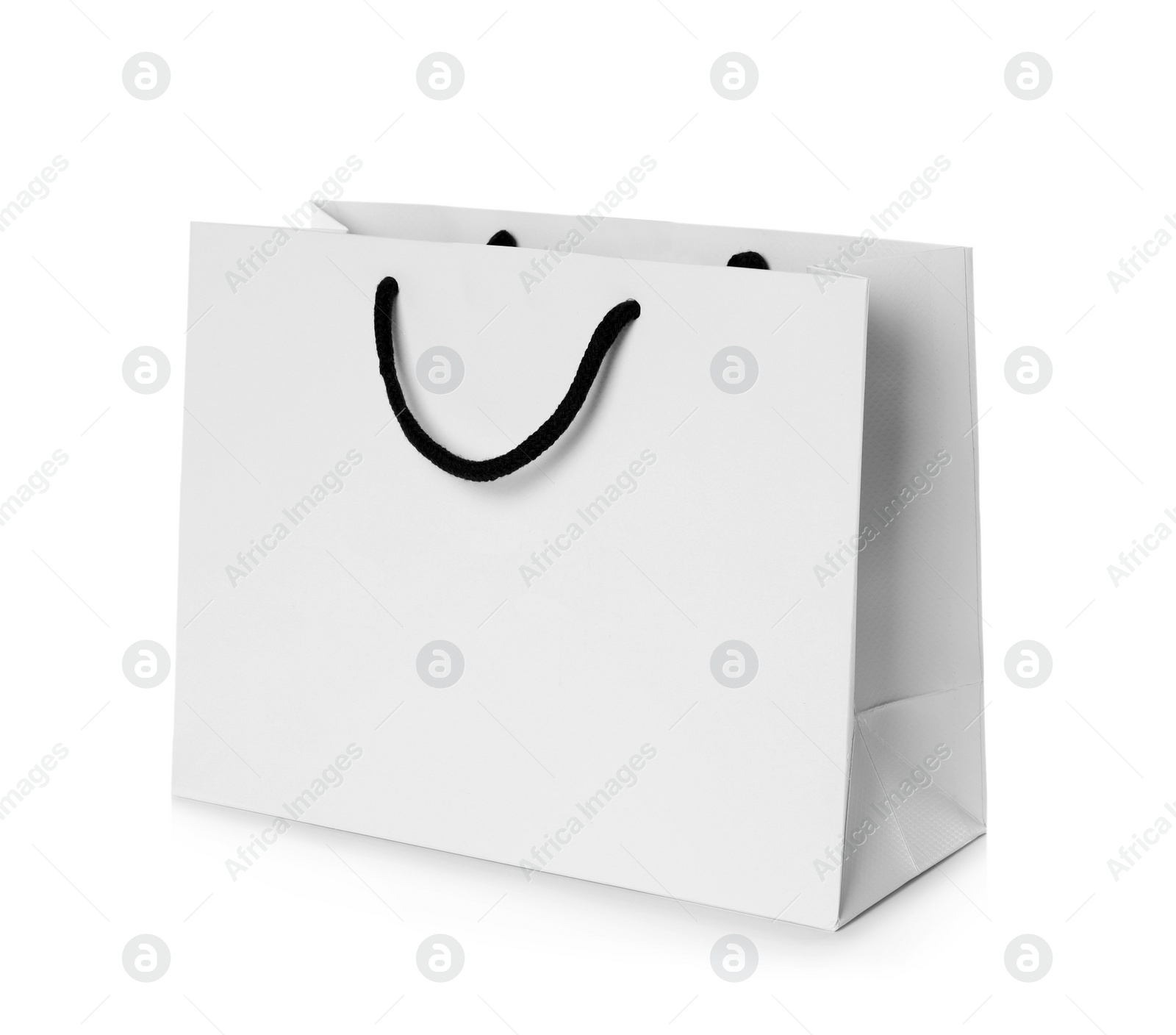 Photo of Paper shopping bag isolated on white. Mock up for design