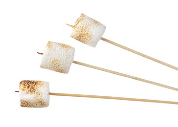 Sticks with roasted marshmallows on white background