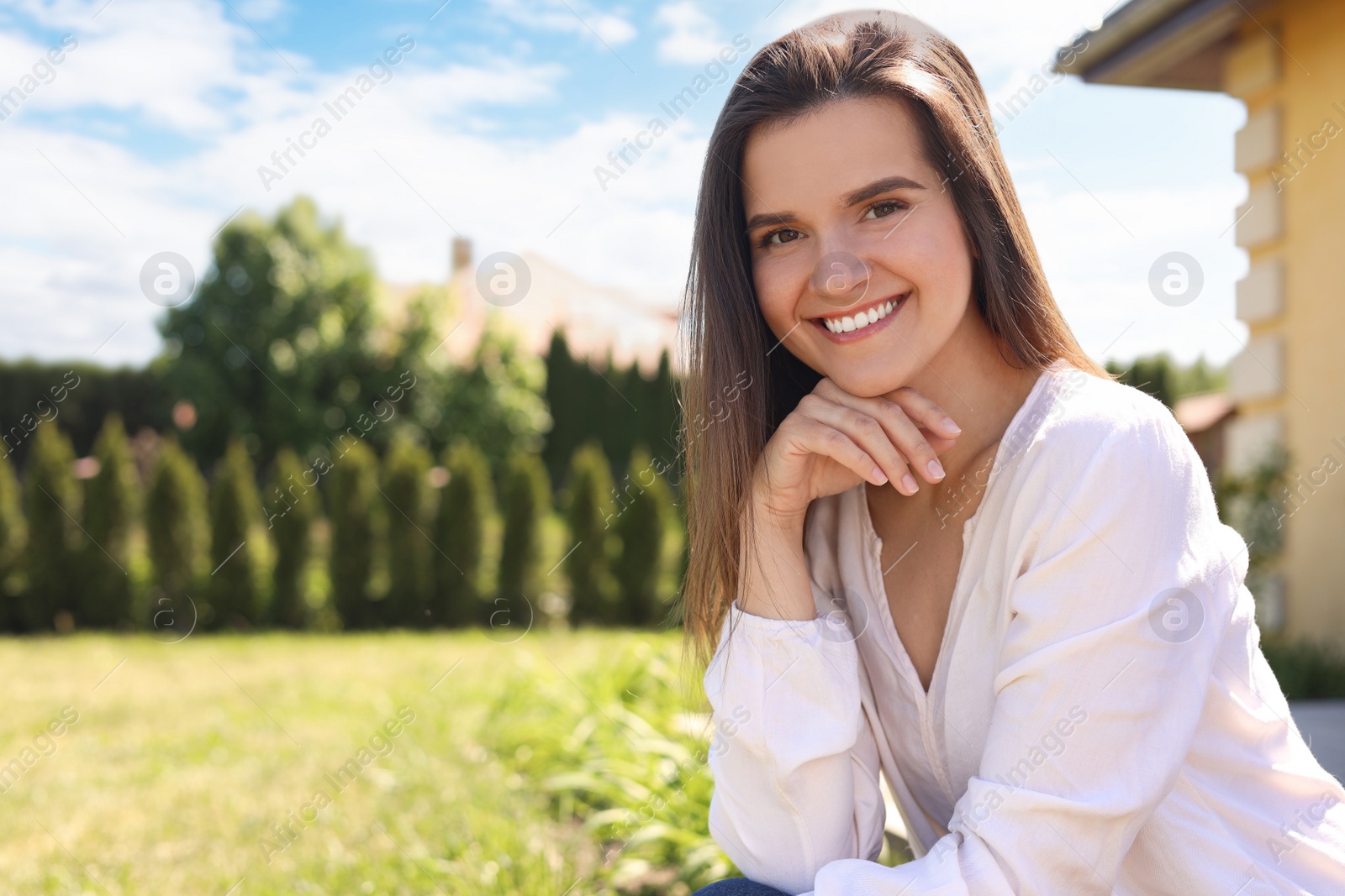 Photo of Portrait of beautiful young woman at backyard, space for text