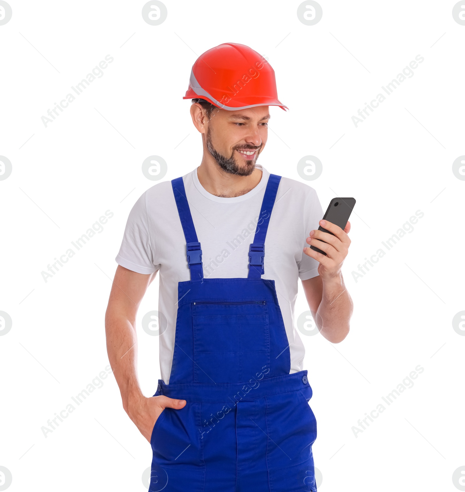 Photo of Professional repairman in uniform with phone on white background