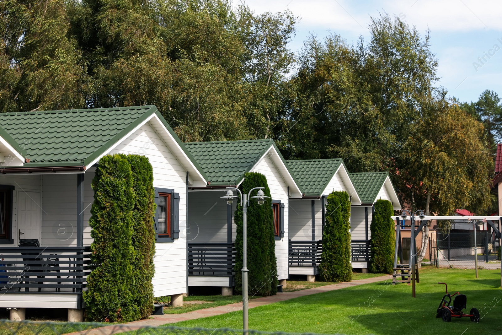 Photo of Exterior of beautiful modern white houses outdoors