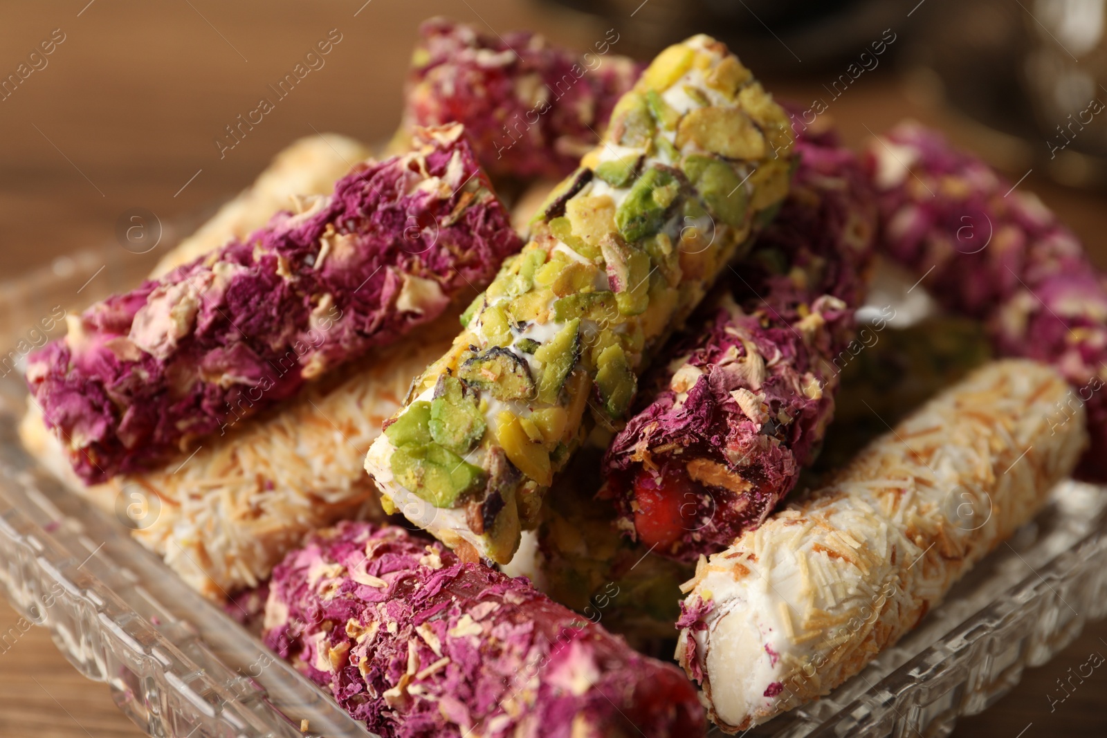 Photo of Turkish delight dessert on wooden table, closeup