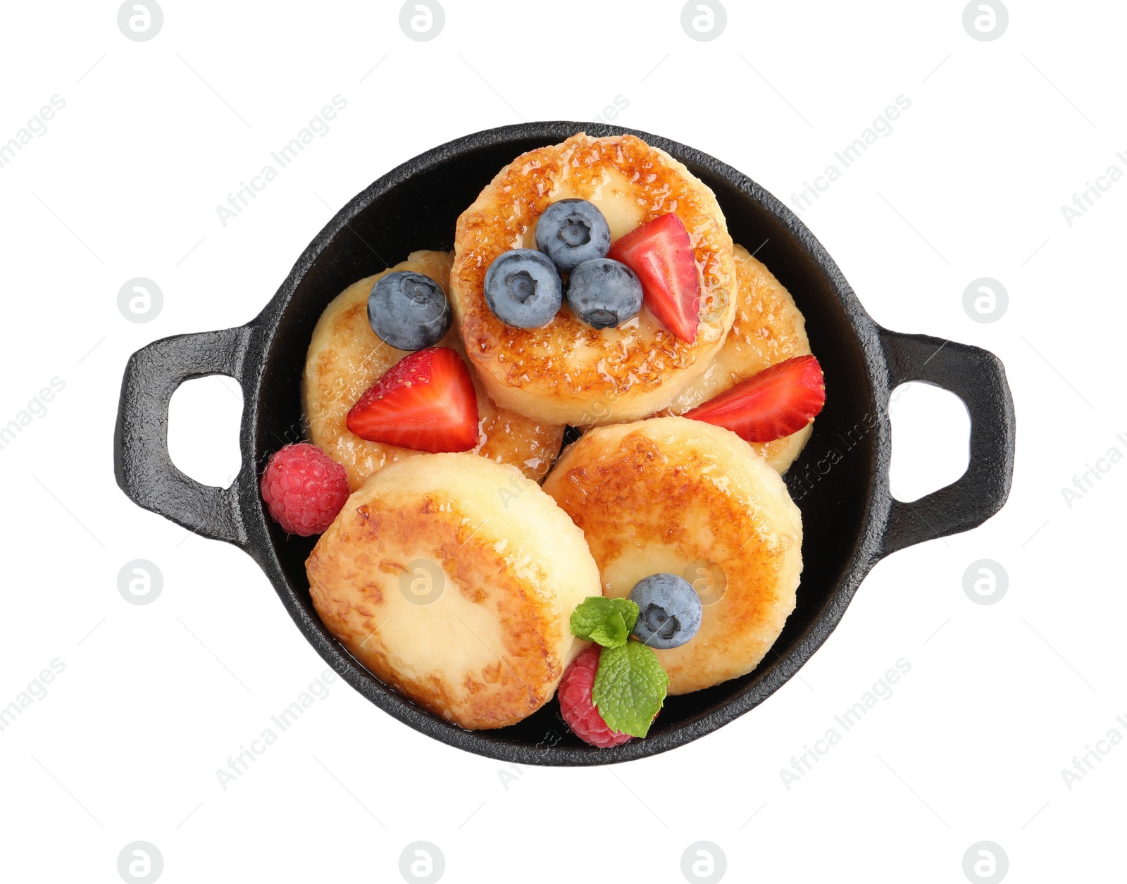 Photo of Delicious cottage cheese pancakes with fresh berries and honey on white background, top view